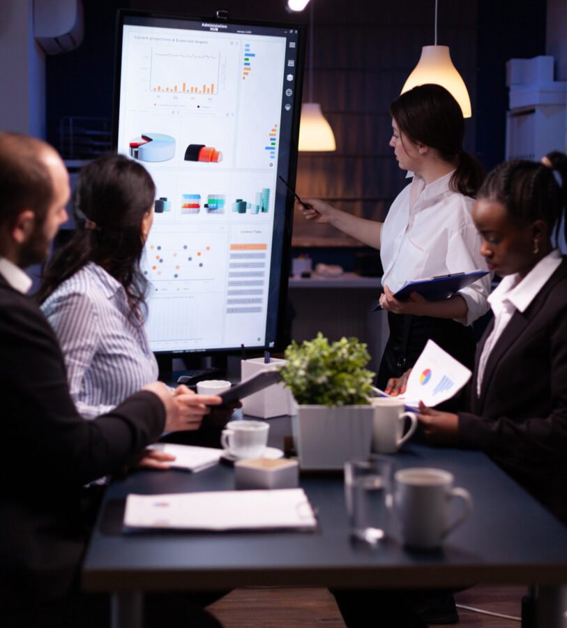 Services 15 Diverse multi ethnic business teamwork overworking in office meeting room analyzing financial graphs