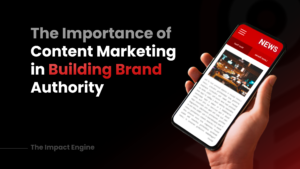 Hand holding a phone with a news article, highlighting 'The Importance of Content Marketing in Building Brand Authority